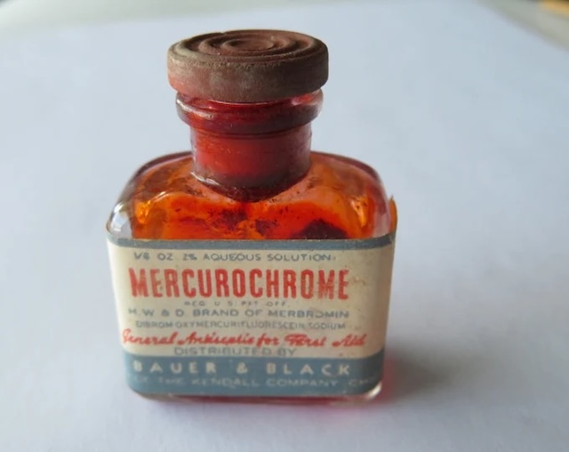 A smaller version of a vintage bottle of Mercurochrome, highlighting the 2% aqueous solution, once trusted by families for everyday first aid treatments