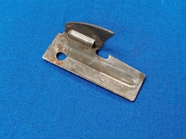 A vintage GI can opener, known for its sturdy design and ease of use, still fascinates collectors and military enthusiasts today