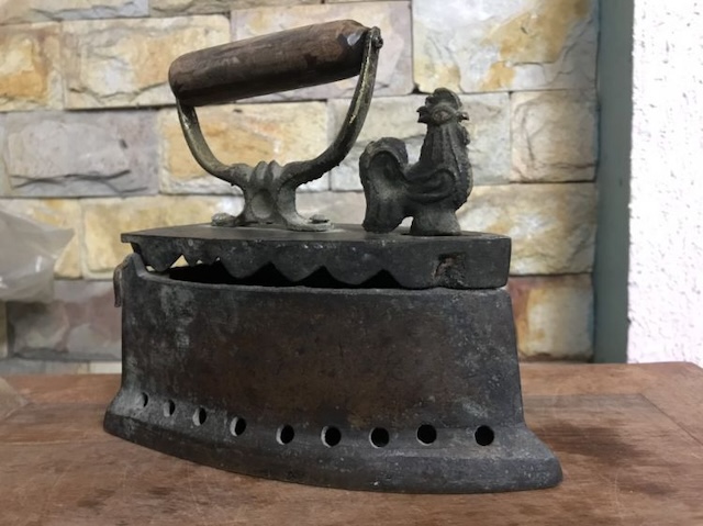 A heavily used, weathered coal iron – bearing the marks of time, this antique piece is a reminder of the labor-intensive process of ironing in the past