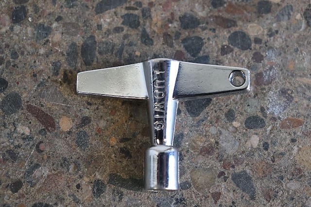 A vintage Ludwig drum key, known for its durability and classic design, favored by drummers for decades