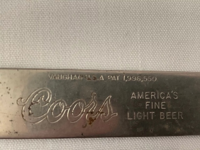 A preserved example of the vintage Coors bottle opener, reflecting the brand's heritage and a tool used by many over the decades