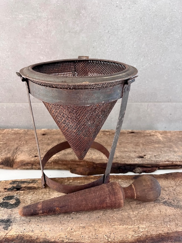 With its rustic appeal, this food strainer and pestle set adds a vintage touch to any kitchen, evoking memories of traditional cooking methods passed down through generations