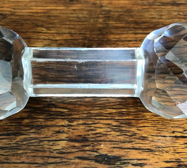 Side view of a crystal knife rest, revealing the clean lines and polished surface that make it a true table gem