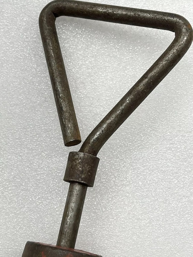 An up-close look at the head of this vintage auto dent puller, designed to grip and pull out those pesky dents on car surfaces