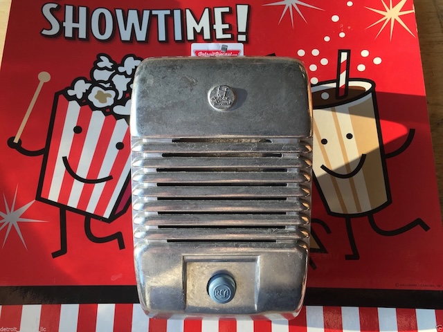 It's showtime! This gleaming vintage drive-in speaker is ready to transport you back to the era of popcorn and open-air films