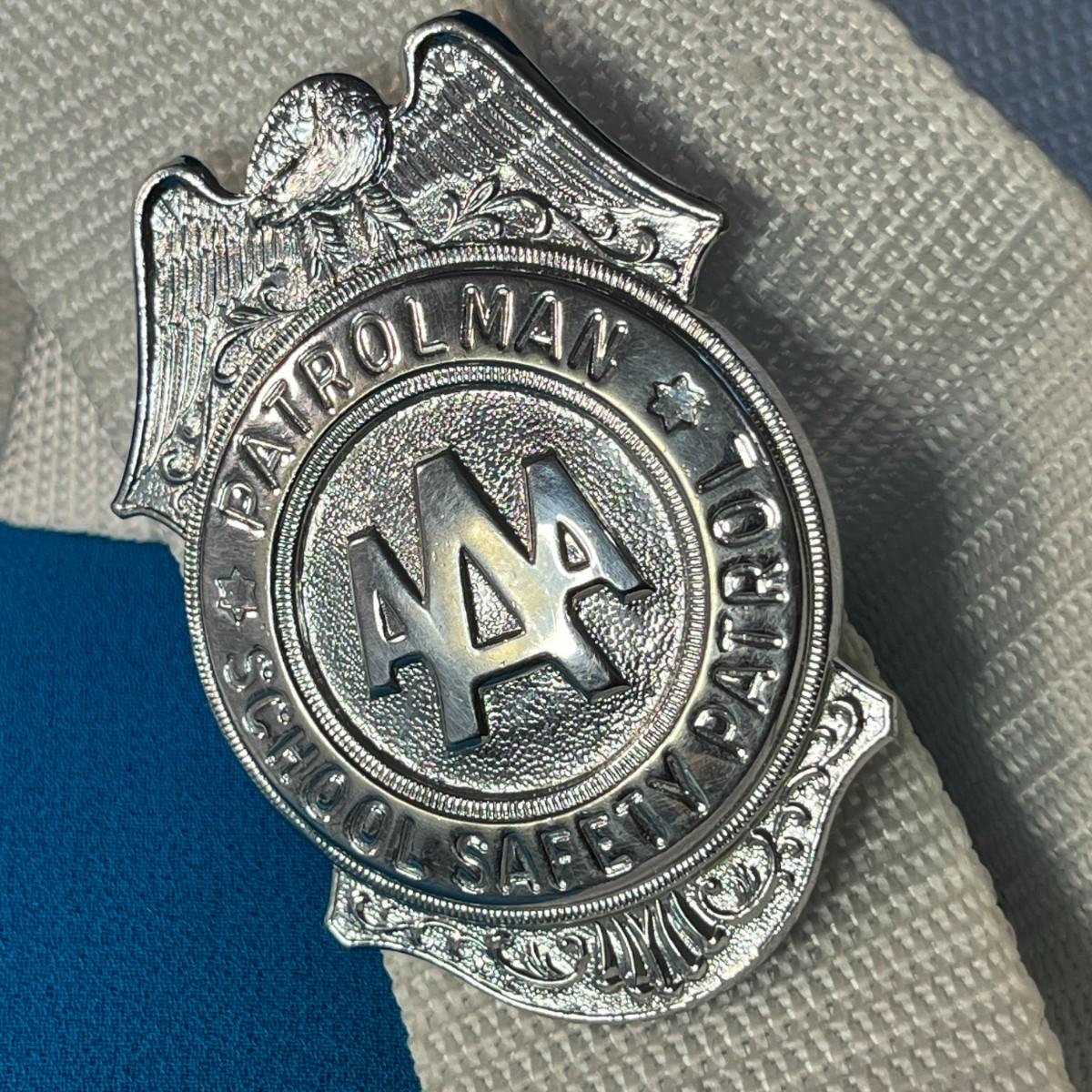 The shiny AAA badge that came with a sense of duty and pride for school safety patrol members