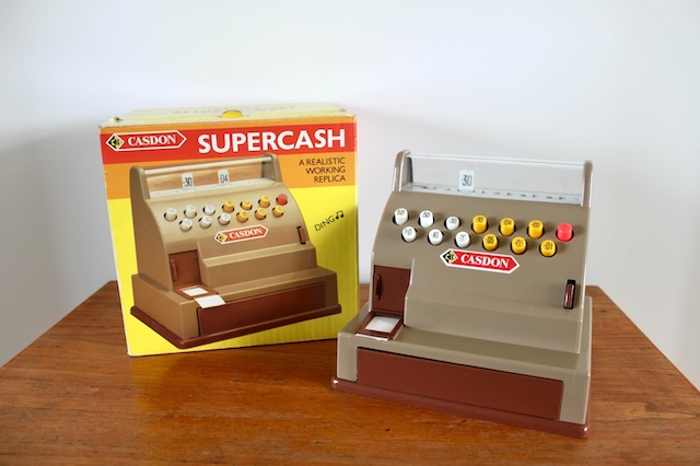 Casdon's 'Supercash' model, complete with its original box, providing a realistic working replica for children’s imaginative play