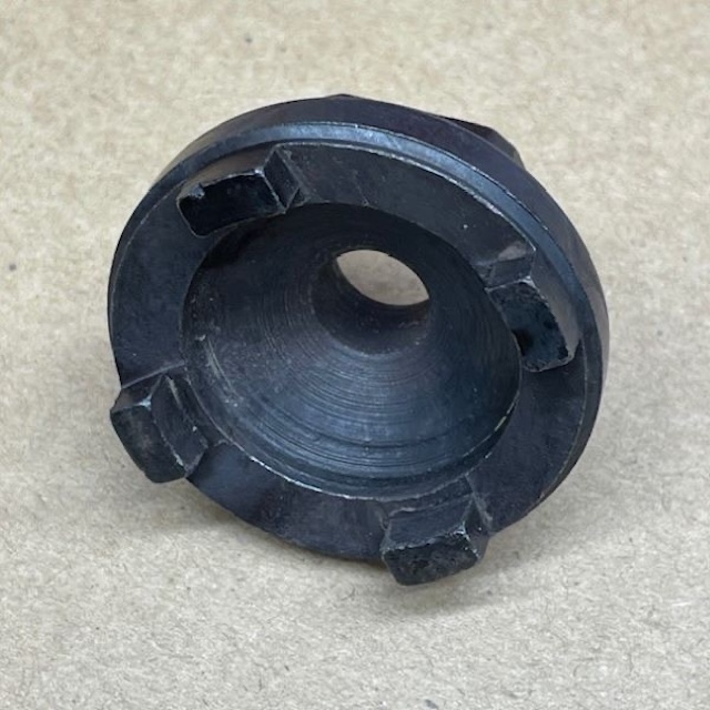 A perspective angle of the tool, illustrating its circular design and sturdy metal construction, allowing for reliable use when removing old cassette hubs