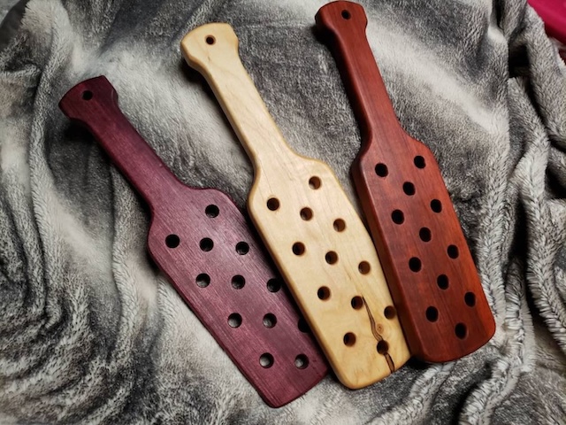 Different shades, same purpose—these paddles evoke memories of a time when discipline meant more than just a warning