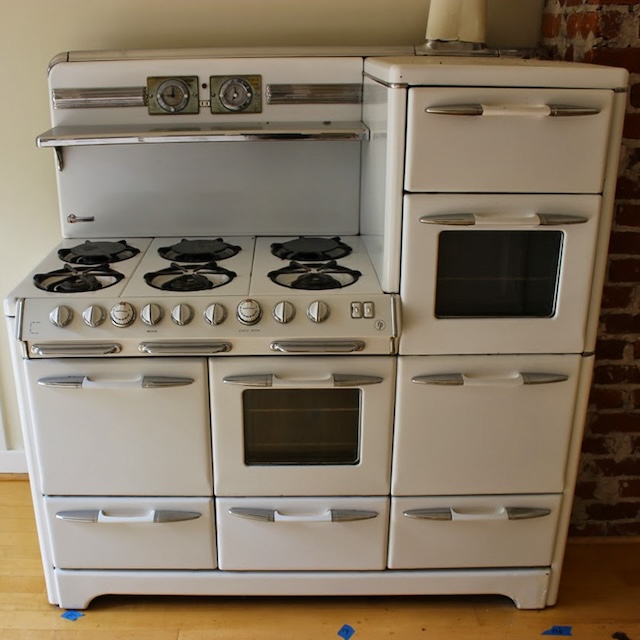 This vintage gas stove isn’t just a cooking appliance; it’s a statement piece, reflecting the cozy and welcoming spirit of old-fashioned kitchens