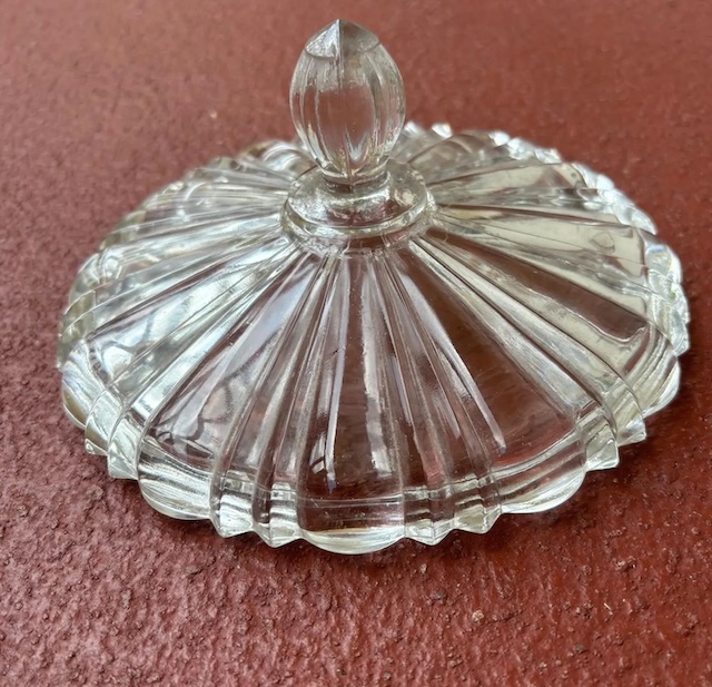 The top view of this candy dish shows the delicately crafted lid, designed to add an air of sophistication to its sweet contents