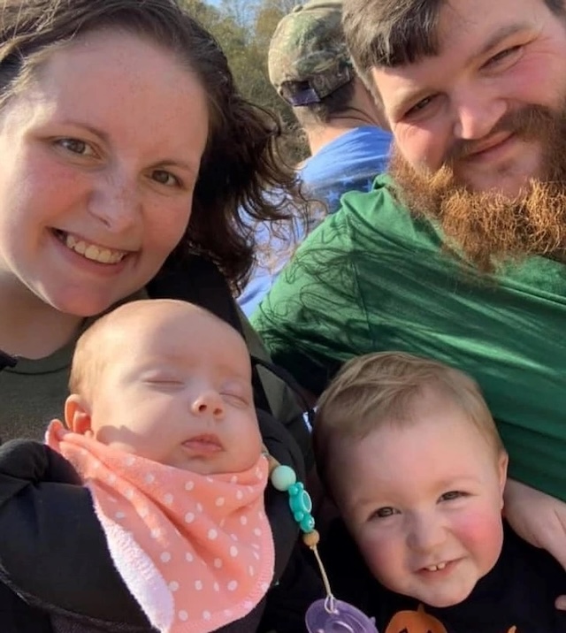 A beautiful family portrait of Michael, his wife Millie, and their two young children enjoying a sunny day together, showing that family is always at the center of his life