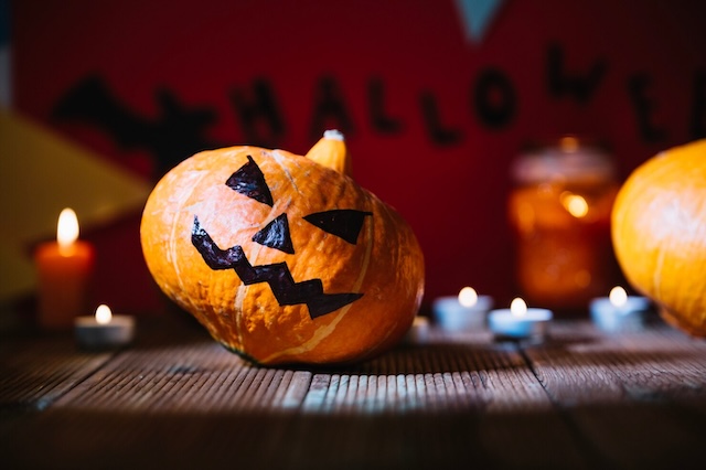 An eerily lit jack-o'-lantern — a symbol of the lengths some will go for holiday perfection