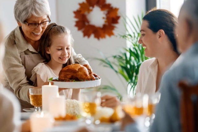 A grandmother and granddaughter share a tender moment, not knowing the upcoming surprise awaiting their meal