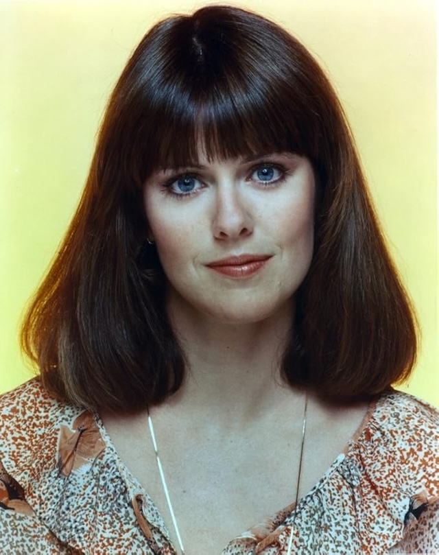 A classic headshot of Pam Dawber, featuring her signature bangs and a calm, confident expression that made her a familiar face on screen