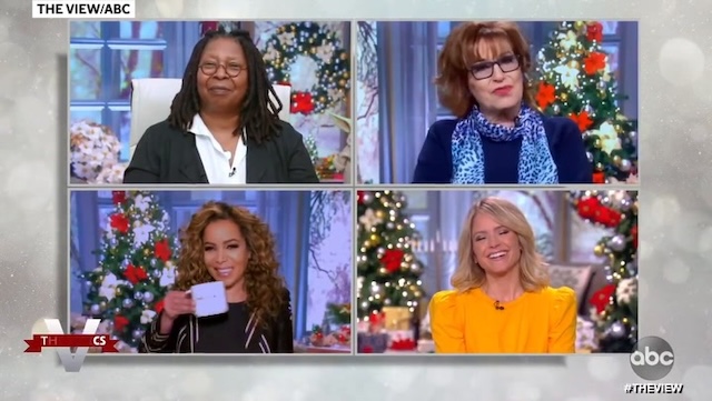 A festive moment from The View as the hosts share a light-hearted conversation in front of a Christmas-themed set