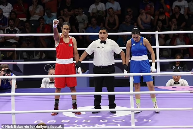 Imane Khelif celebrates victory as the referee declares her the winner, while Angela Carini stands to the side after stopping the fight