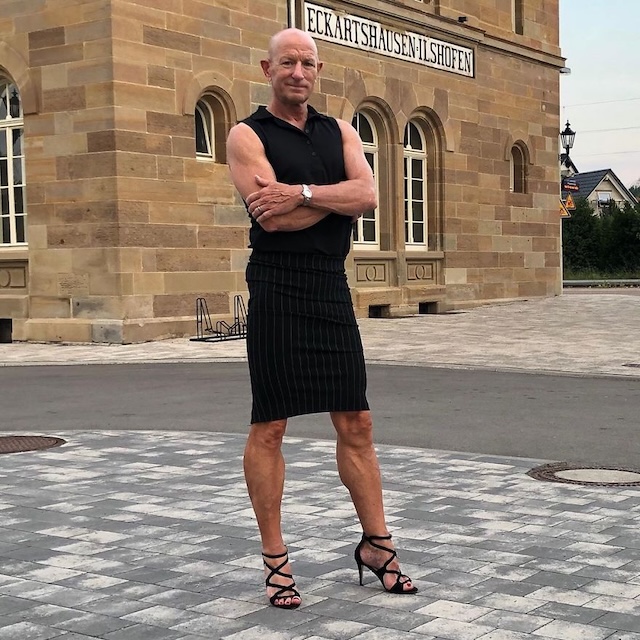 Casual with a twist—sporting a pinstripe skirt and heels on a sunny day