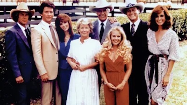 The full Dallas cast gathered for a promotional photo, showcasing the glamorous and high-stakes world of the Ewing family saga