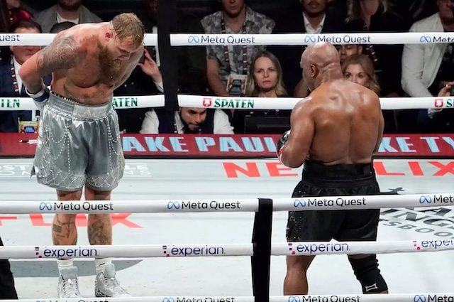 Jake Paul bows to Mike Tyson after their intense battle, showing appreciation for the legendary boxer’s career