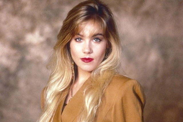 A throwback to Christina Applegate's glamorous 80s look, featuring voluminous hair and a bold style that defined a generation