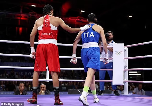 Imane Khelif extends a gesture of sportsmanship by touching Angela Carini’s back as they leave the ring after their bout