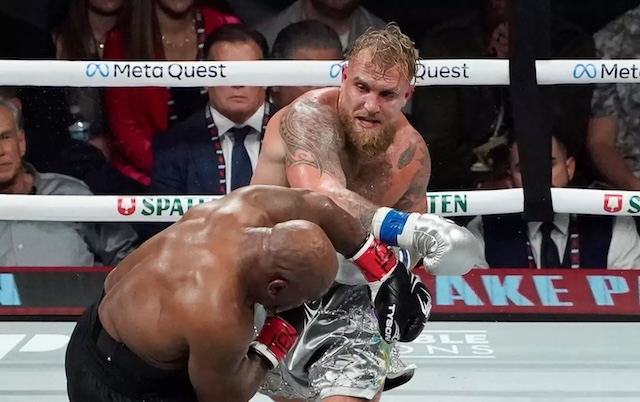 Jake Paul lands a powerful punch on Mike Tyson during their showdown, showcasing the intensity of the match