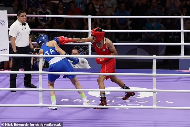 A tense moment captured during the match as Imane Khelif delivers a powerful punch to Angela Carini, showcasing the intensity of the bout