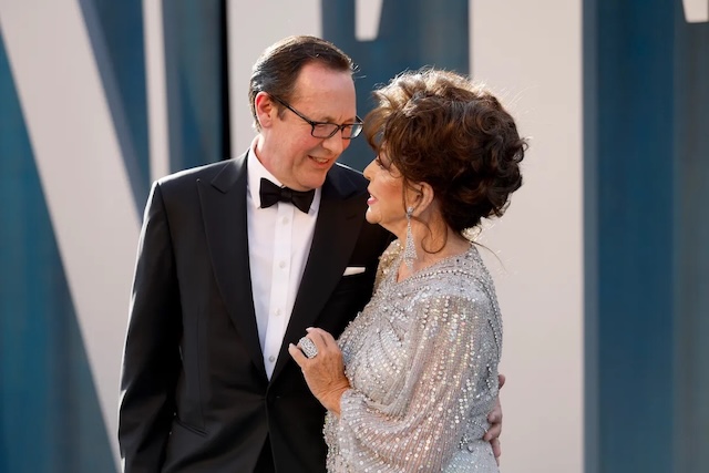 Percy Gibson and Joan Collins at the 2022 Vanity Fair Oscar Party at Wallis Annenberg Center for the Performing Arts on March 27, 2022 in Beverly Hills, California