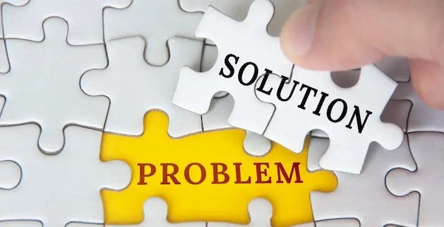 A conceptual image depicting the process of solving problems, symbolized by puzzle pieces labeled "problem" and "solution," being connected by a hand