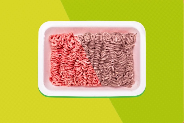 Half-red, half-gray ground beef in its packaging. Gray in the middle isn’t always a cause for concern—this color change can be due to lack of oxygen