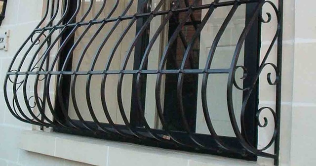 Window grills featuring elegantly curved bottoms—more than just decorative, they serve an essential function