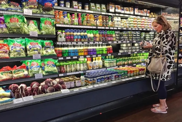 A grocery aisle packed with colorful snack options, each with its own ambiguous expiration labels