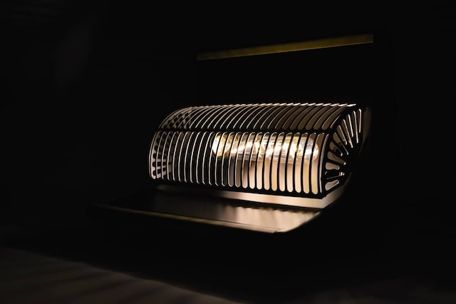 A vintage revo electric heater illuminating a room, showcasing its iconic design and functionality that made it an essential in homes during colder months