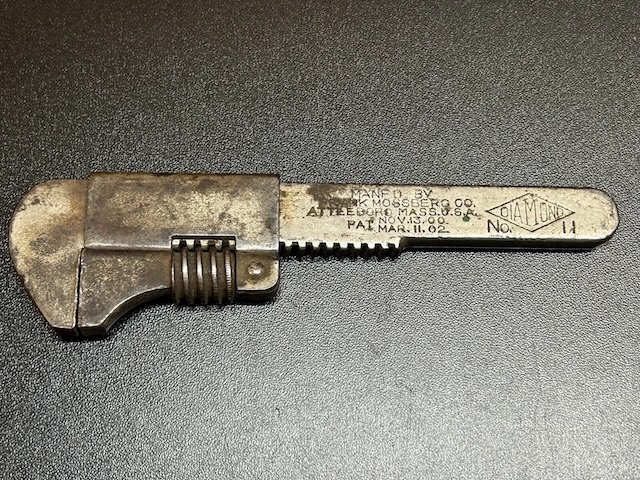 An old yet robust vintage adjustable wrench with distinct markings, a tool that’s witnessed countless repairs and adjustments