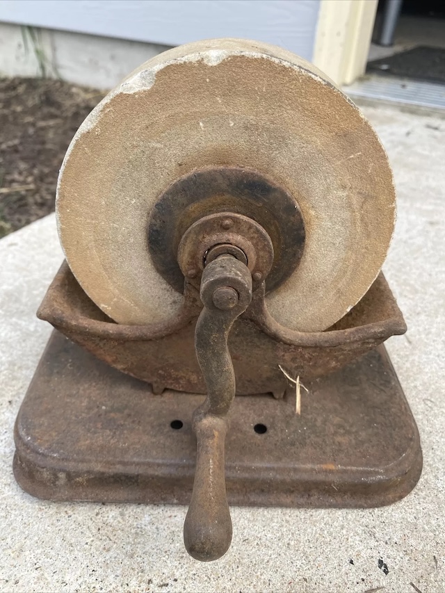 The Antique Cast Iron Hand Grinder Sharpener Stone Wheel was a go-to for tool maintenance, now a nostalgic relic