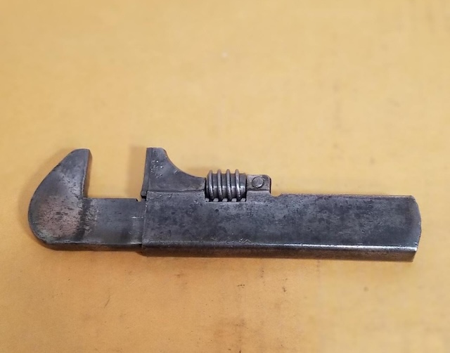 Timeworn yet functional – a vintage adjustable wrench that once made household repairs and mechanical work more manageable for generations past