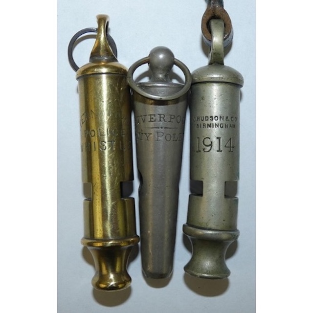 These whistles, with markings from Liverpool and Birmingham, are artifacts of early 20th-century law enforcement