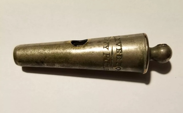 A single whistle showing the wear of time and the engraved "Liverpool City Police," steeped in history