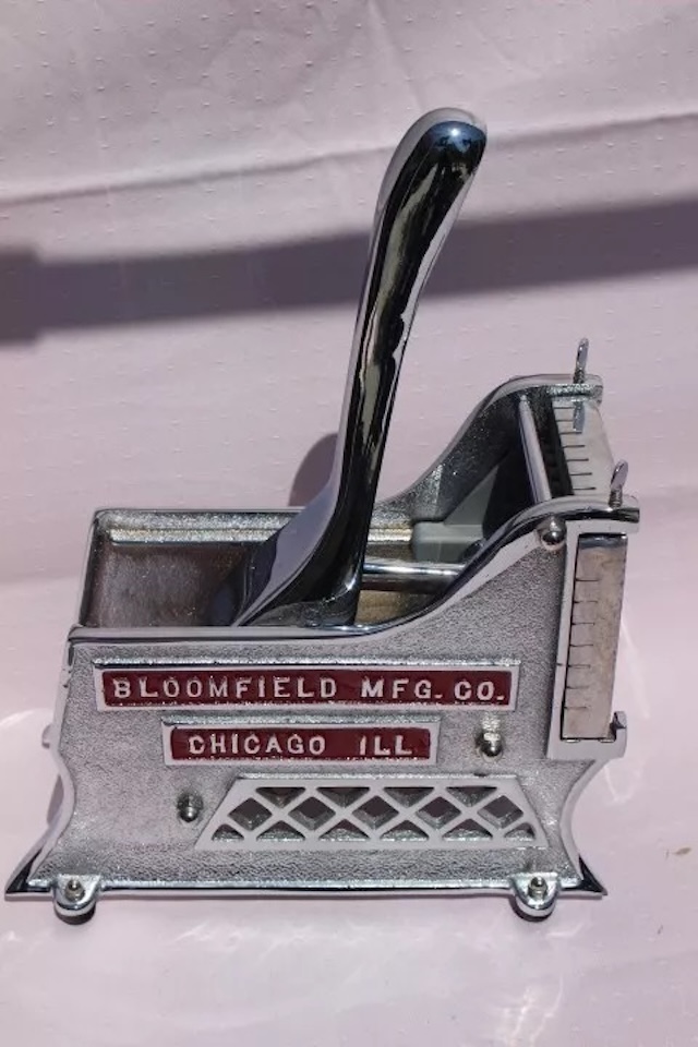 A fully restored version of the vintage Bloomfield vegetable cutter or slicer, gleaming with chrome accents and polished details, ready to shine in any vintage collection