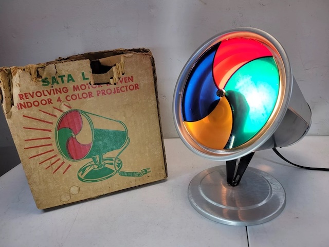 A showcase of various Evergleam Color Wheel models, highlighting the innovation and aesthetic appeal of this mid-century Christmas classic