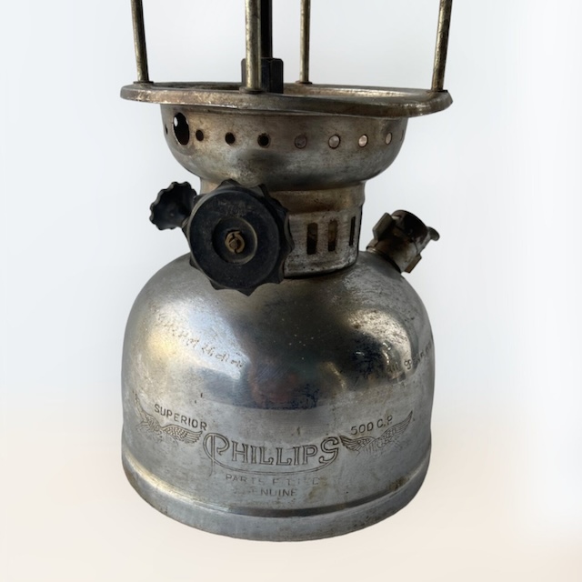 Close-up of the Phillips branding on the vintage kerosene pressure lantern, marked as a 'Superior' model, reflecting its durable build and classic appeal