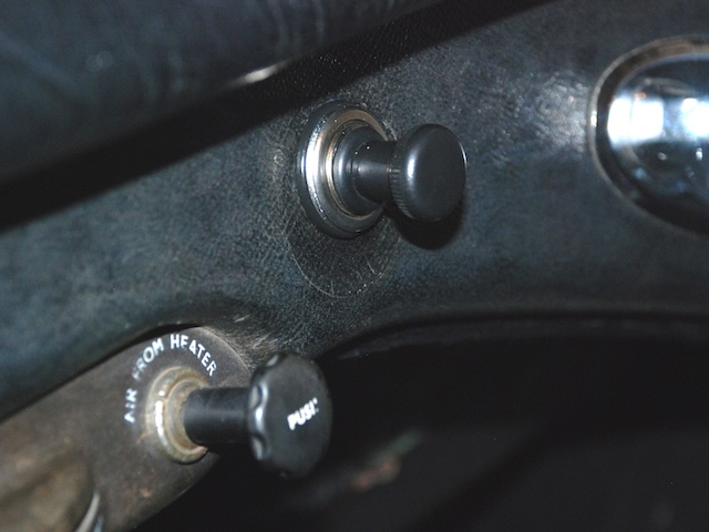 Mounted on the dashboard, this old-school car cigarette lighter served as both a convenience and a piece of nostalgia for drivers