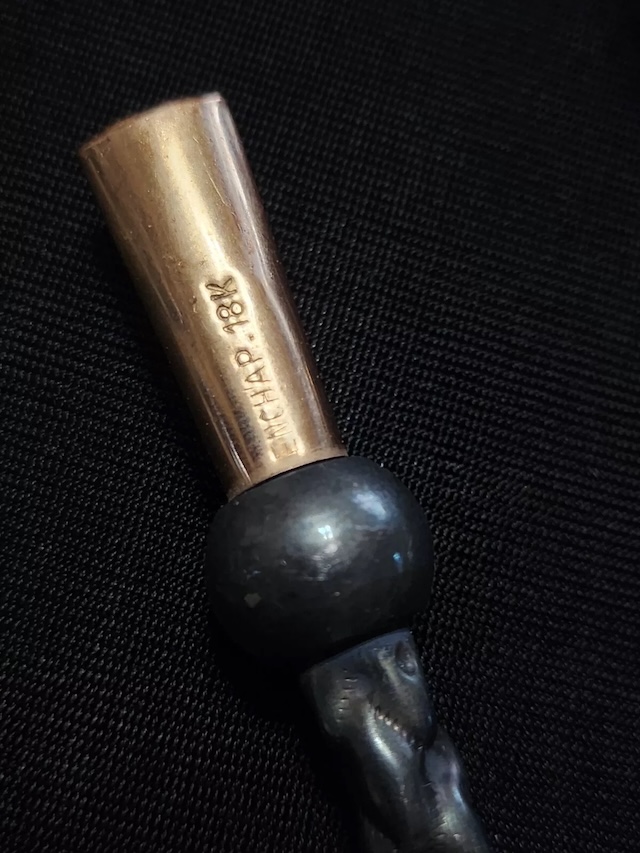 Detailed view of the mouthpiece highlighting its fine engraving