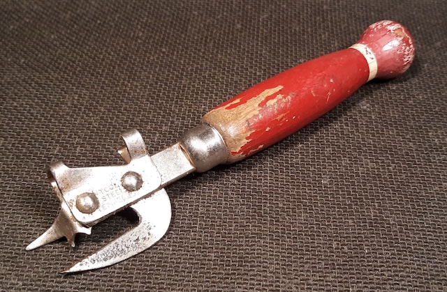 Detailed view of the mechanism, highlighting the durable steel components and classic design of this vintage can opener