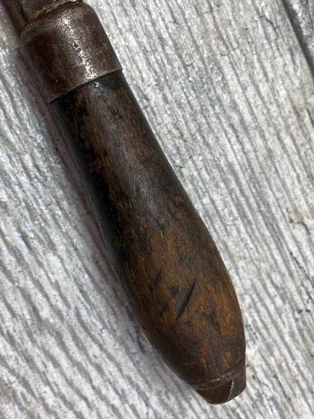 Handle wear and patina tell the story of countless jobs done with this vintage Stillson wrench, a true relic of hard work