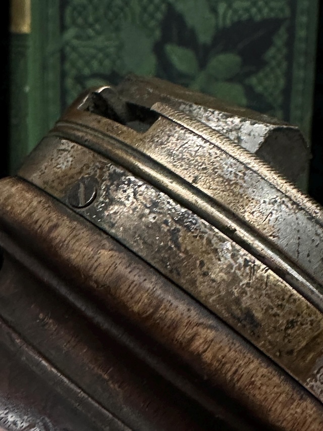 A closer look at the engraved brass components of the Antique Wooden Rotating Workbench, showcasing the tool's historical significance and the fine craftsmanship of the era.