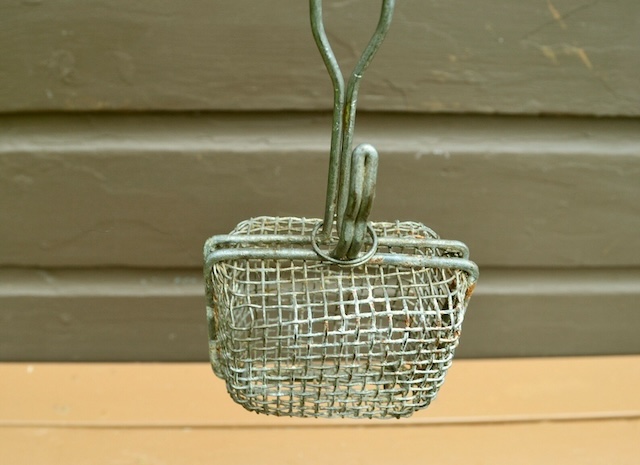 Hanging elegantly, this vintage Wire Basket Soap Saver demonstrates its practical design—a perfect blend of function and thriftiness