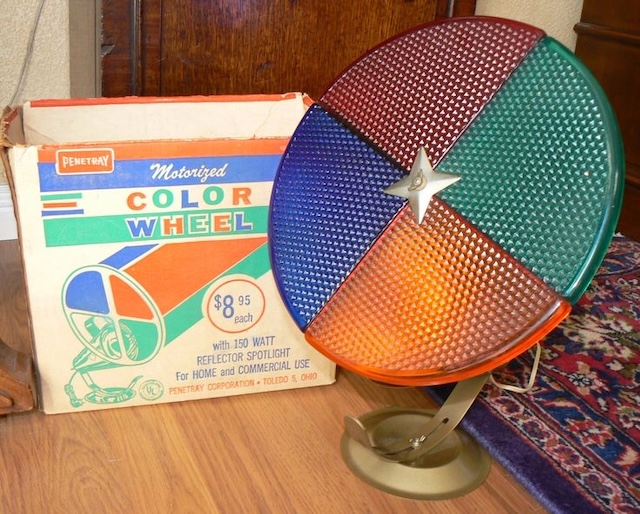 Rows of pristine "Evergleam Color Wheels" alongside their original boxes, each one a glowing reminder of vintage Christmas cheer