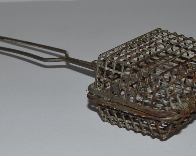 Close-up of the intricate wire mesh construction of the vintage Wire Basket Soap Saver, a relic of sustainable living from decades past